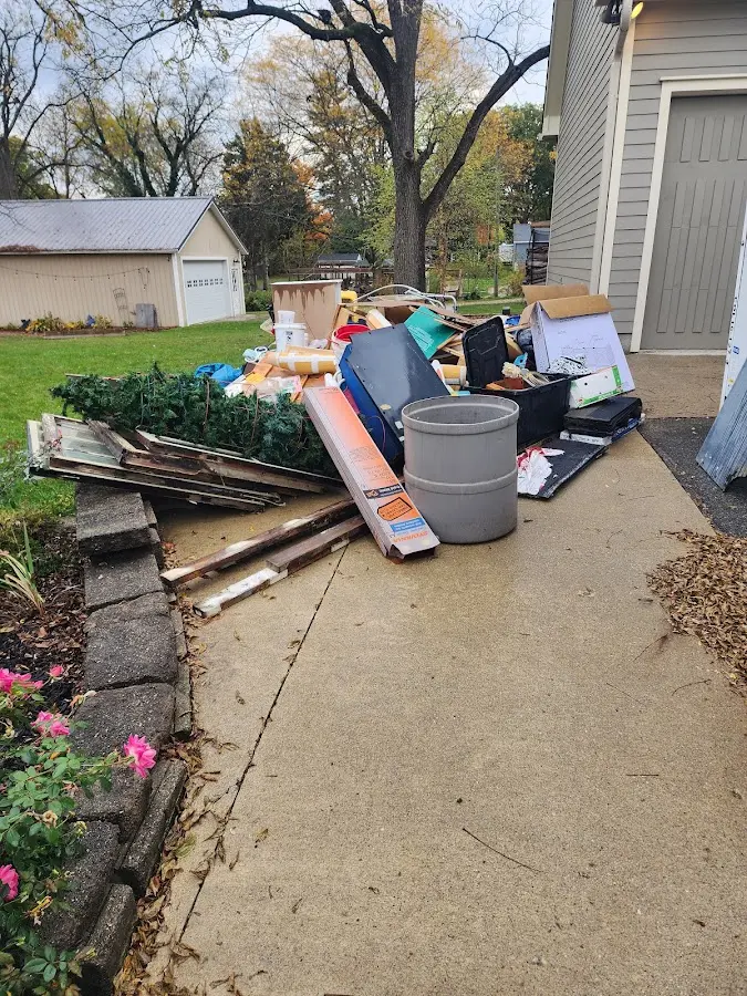 Dumpster being loaded with debris for Estate Cleanout Dumpster Rental in Springettsbury